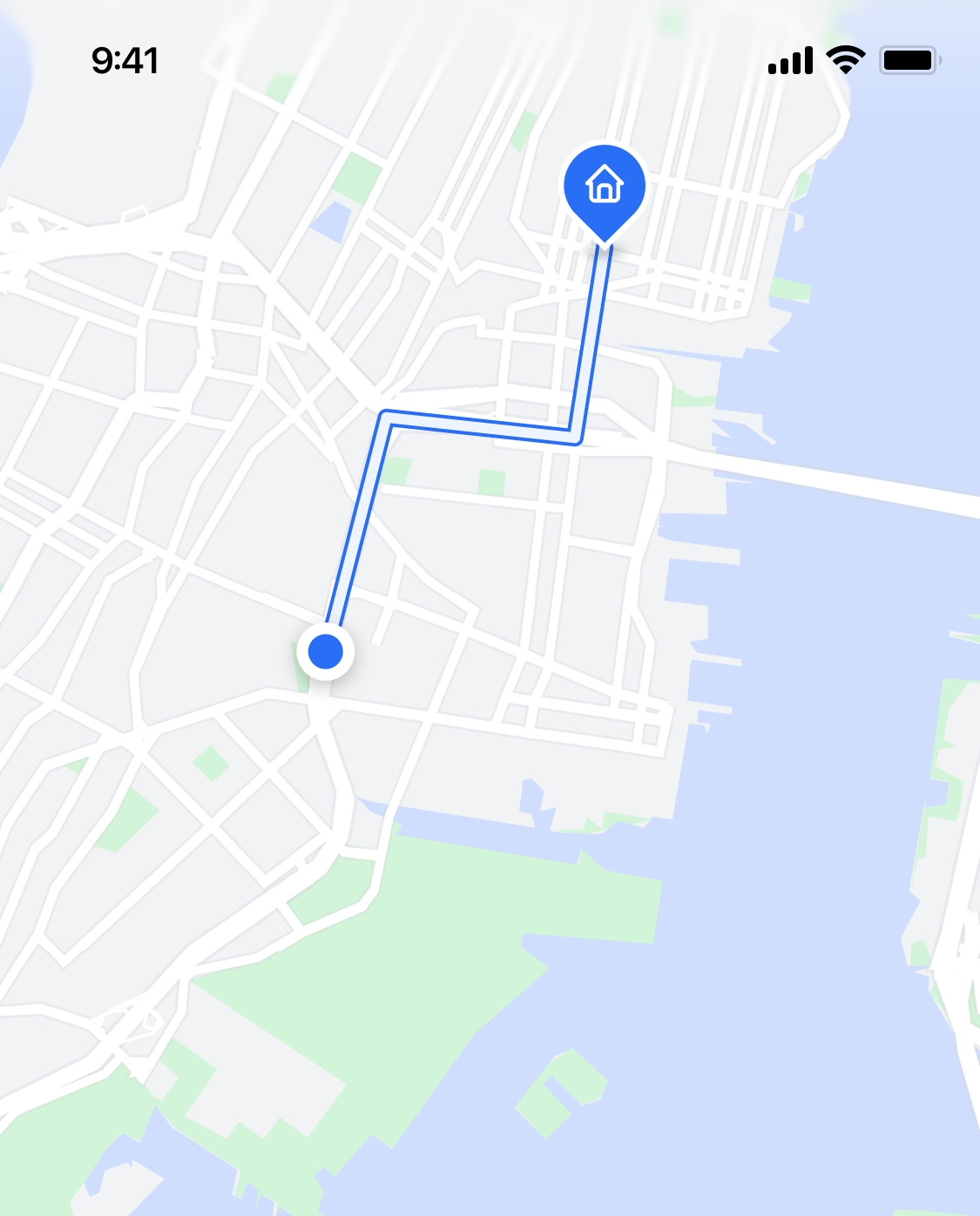 Map showing a route from the user’s location (blue dot) to a house icon through city streets.